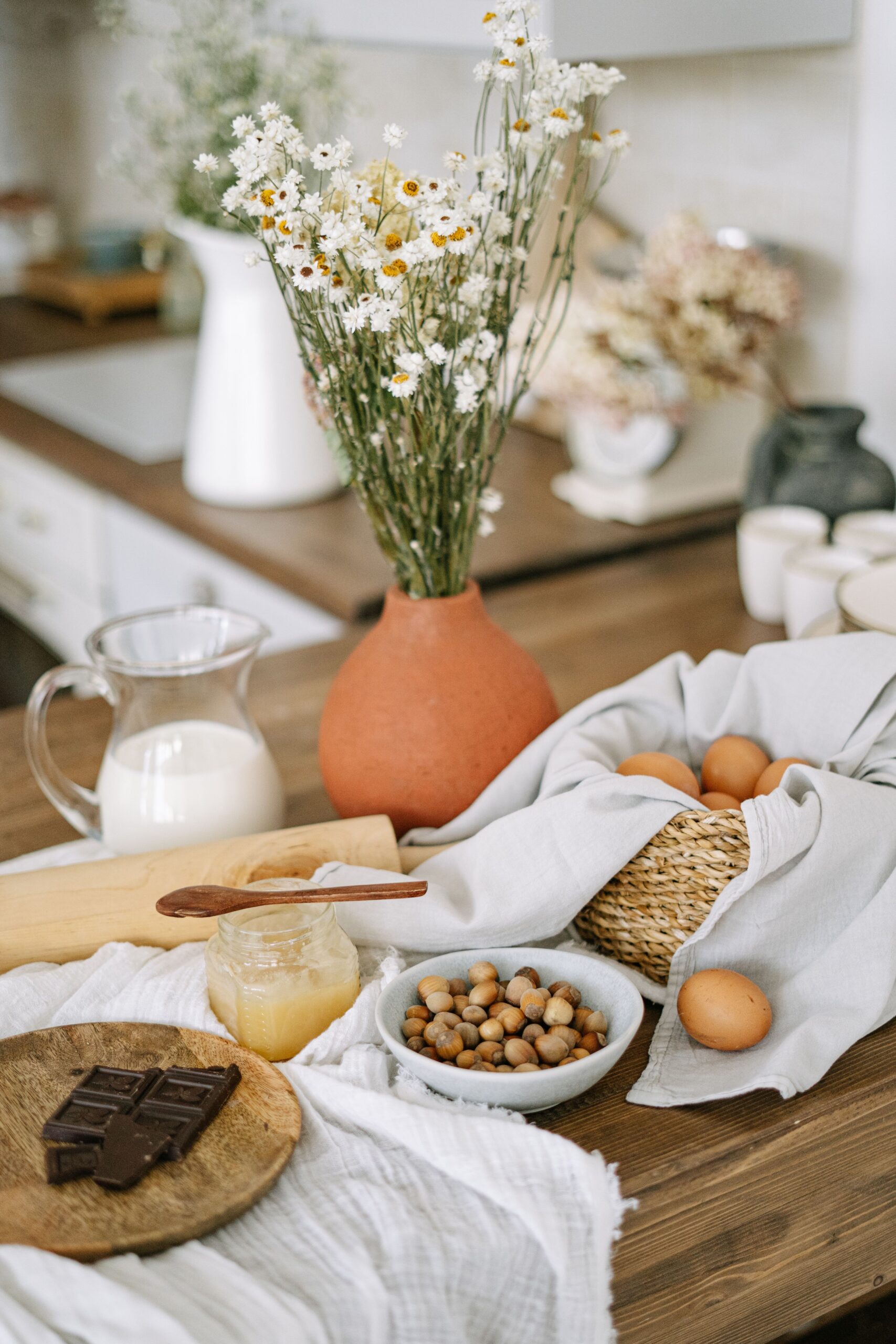 Table set with flowers, fresh food and linen