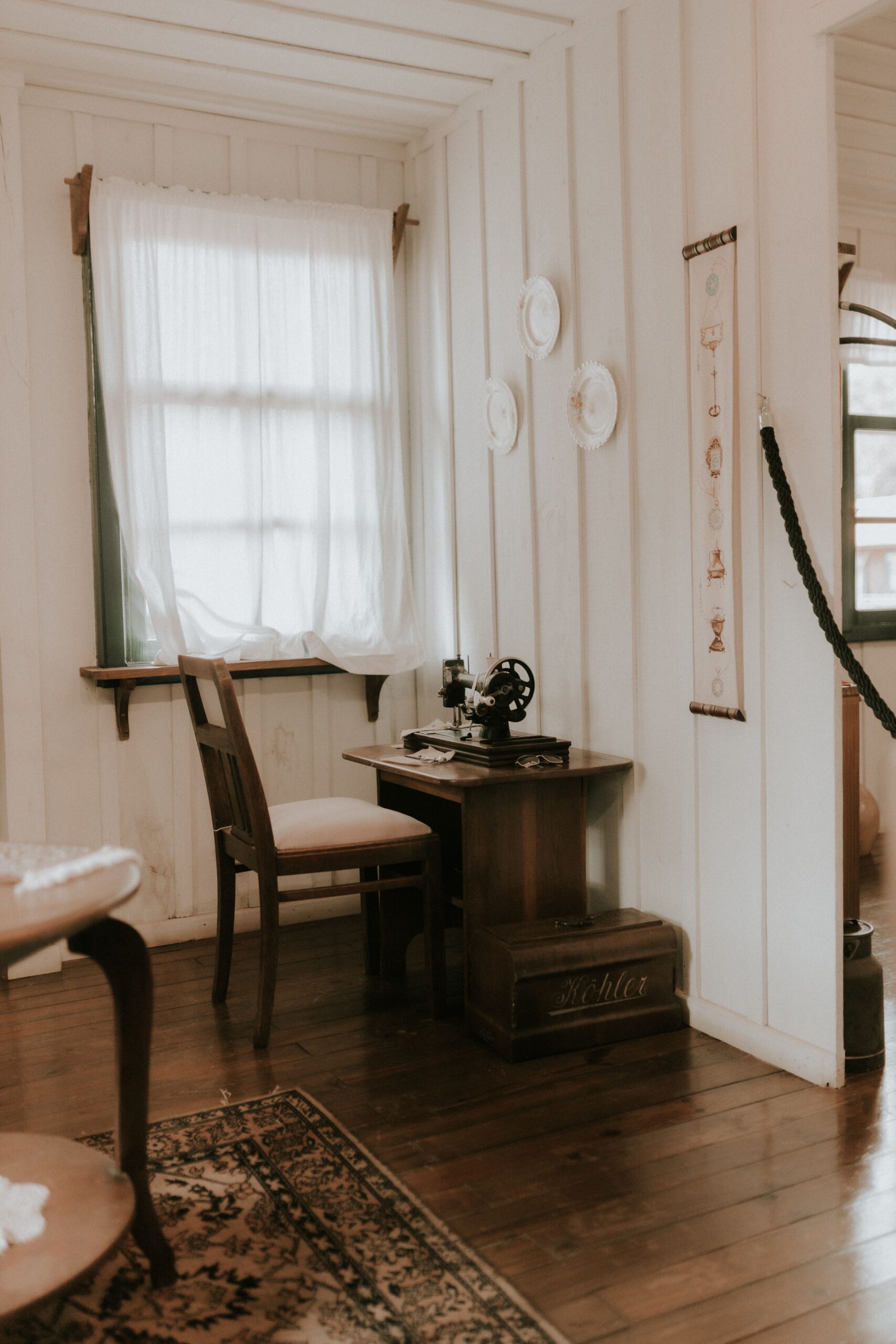 Cozy cottage corner with a window and a wooden chair