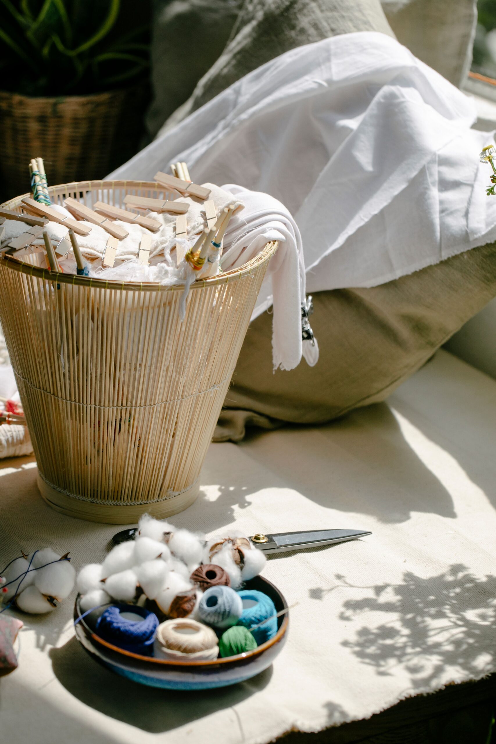 Basket of linens with a bowl of beads